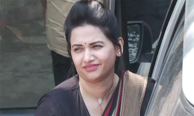 Pavithra Gowda spotted arriving in a car during a public appearance.